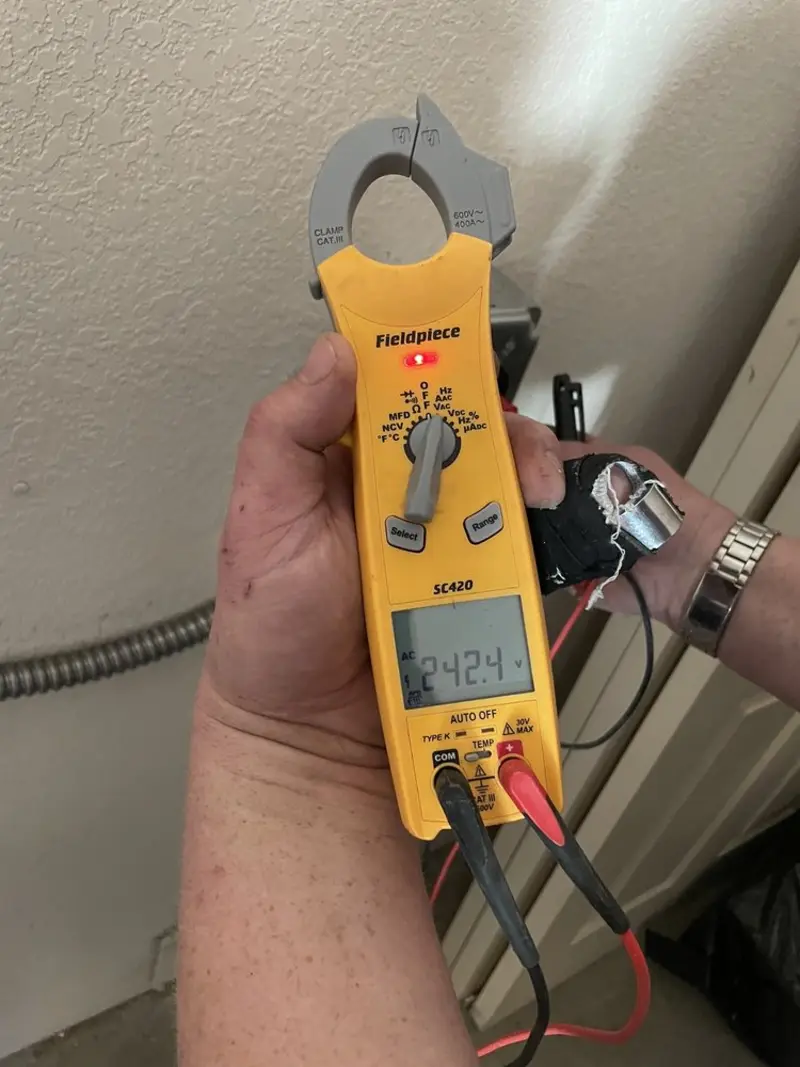 Voltage testing with clamp meter during Aluminum Wiring Replacement in Napoleon